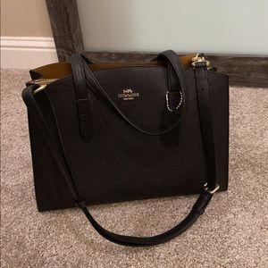 Coach “Charlie medium carryall in pebble leather”